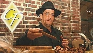 Cigar roller cigar events popular with ski and golf crowds. Cigar roller at corproate golf event